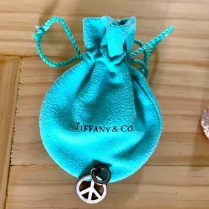 Tiffany & Co. Peace Sign Sterling Silver Pendant.